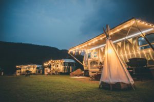 Camping with RVs and tents at night